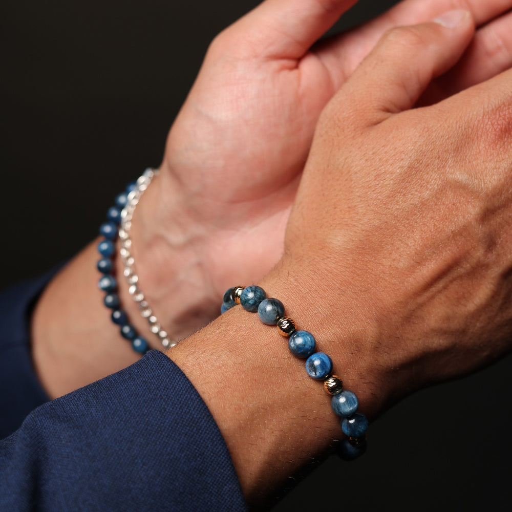 Kyanite natural stone beaded bracelet with 18K gold accents worn on wrist